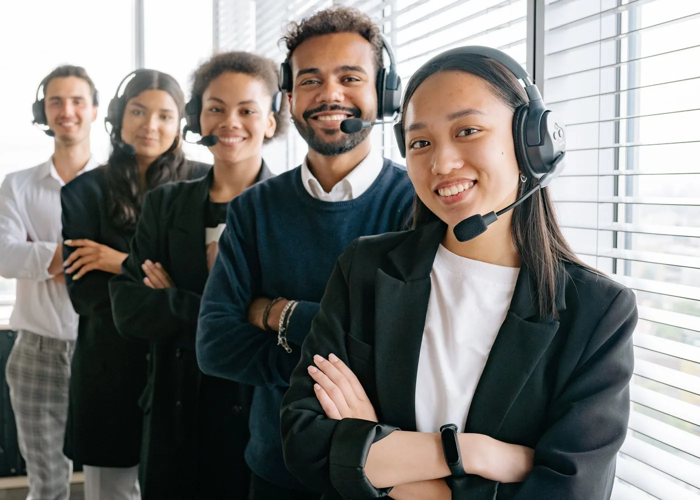 Case handlers on headsets at their desks